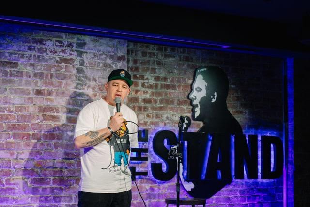 Comedian performing on stage